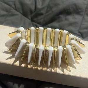 New gold and white plastic triangle shape bracelet